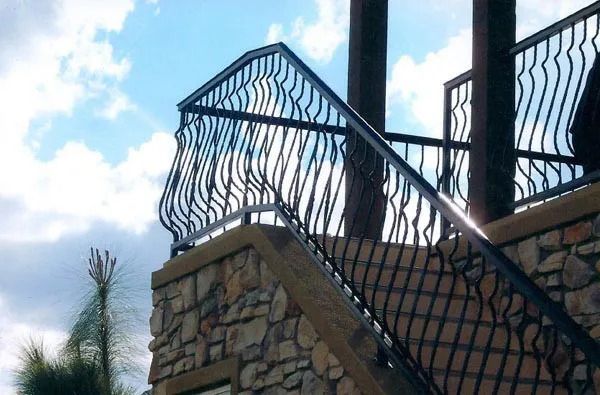 A wooden gate is in front of a house