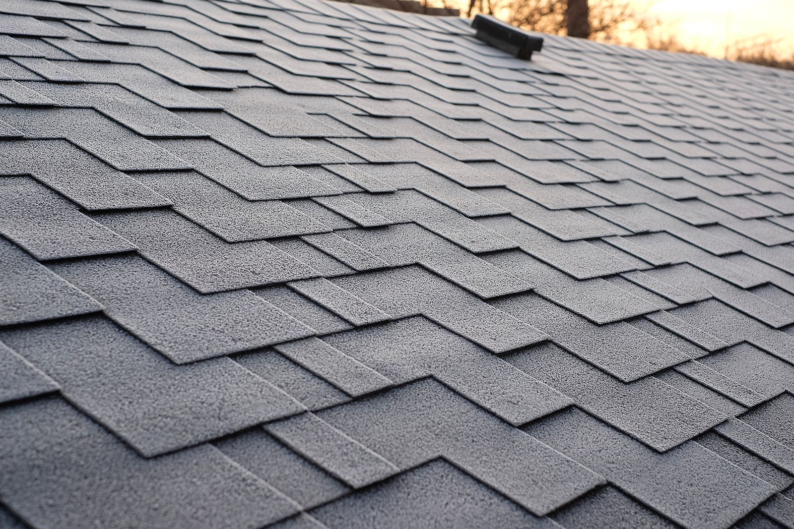 A close up of a roof with shingles on it.