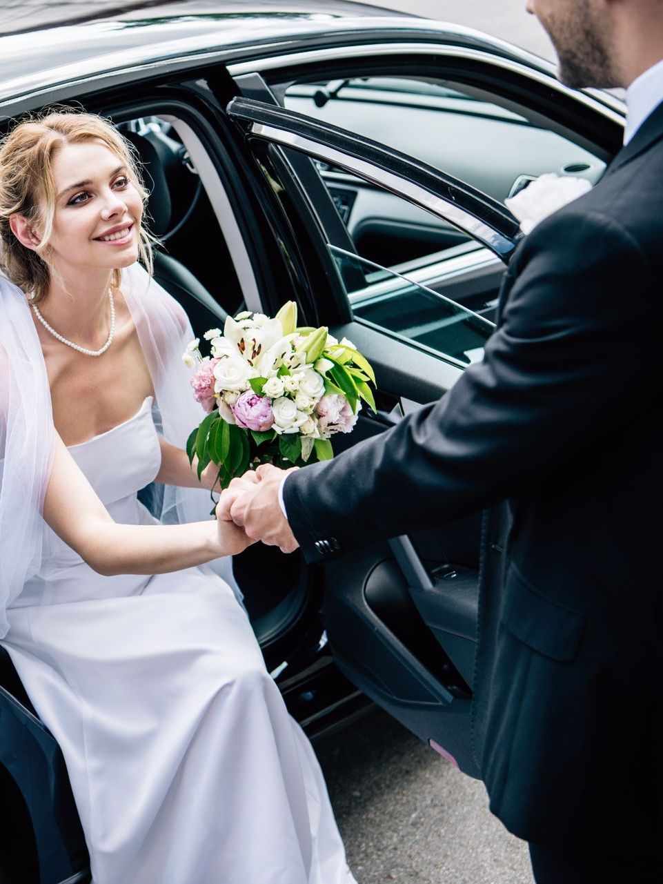 bride getting off a luxury car