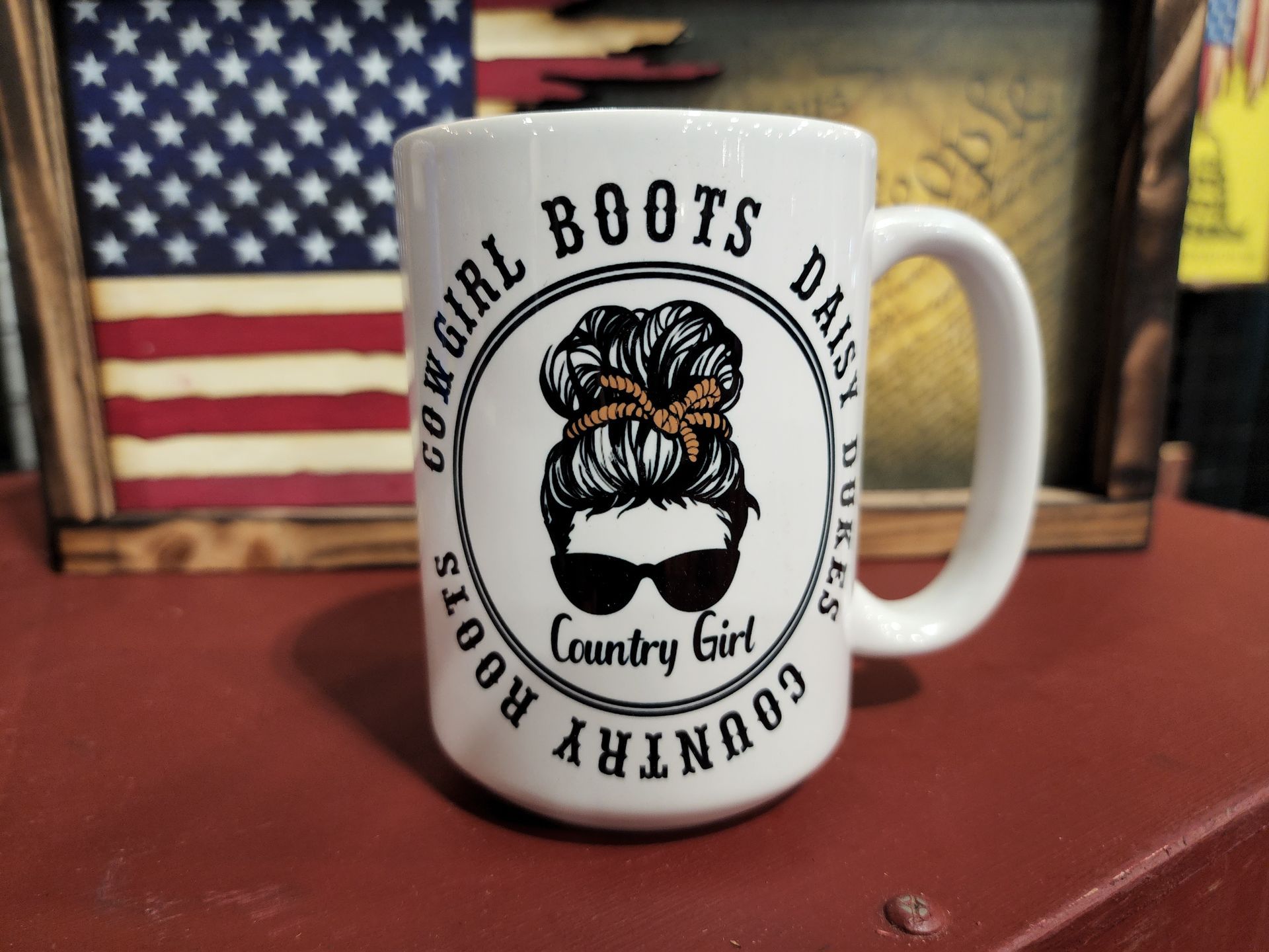 A mug that says country girl boots on it