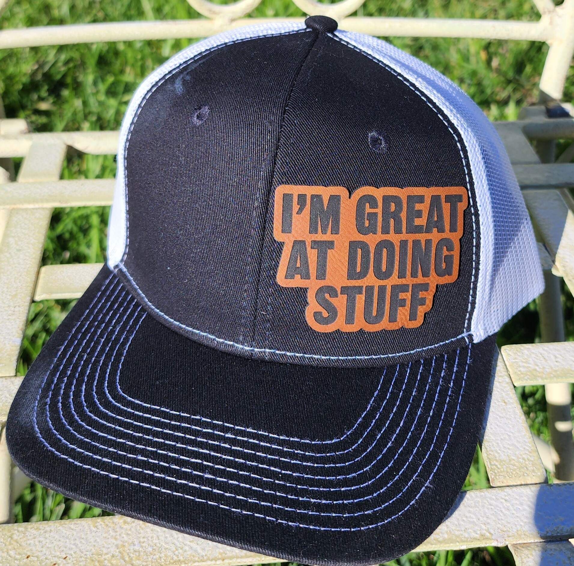A baseball cap that says i 'm great at doing stuff