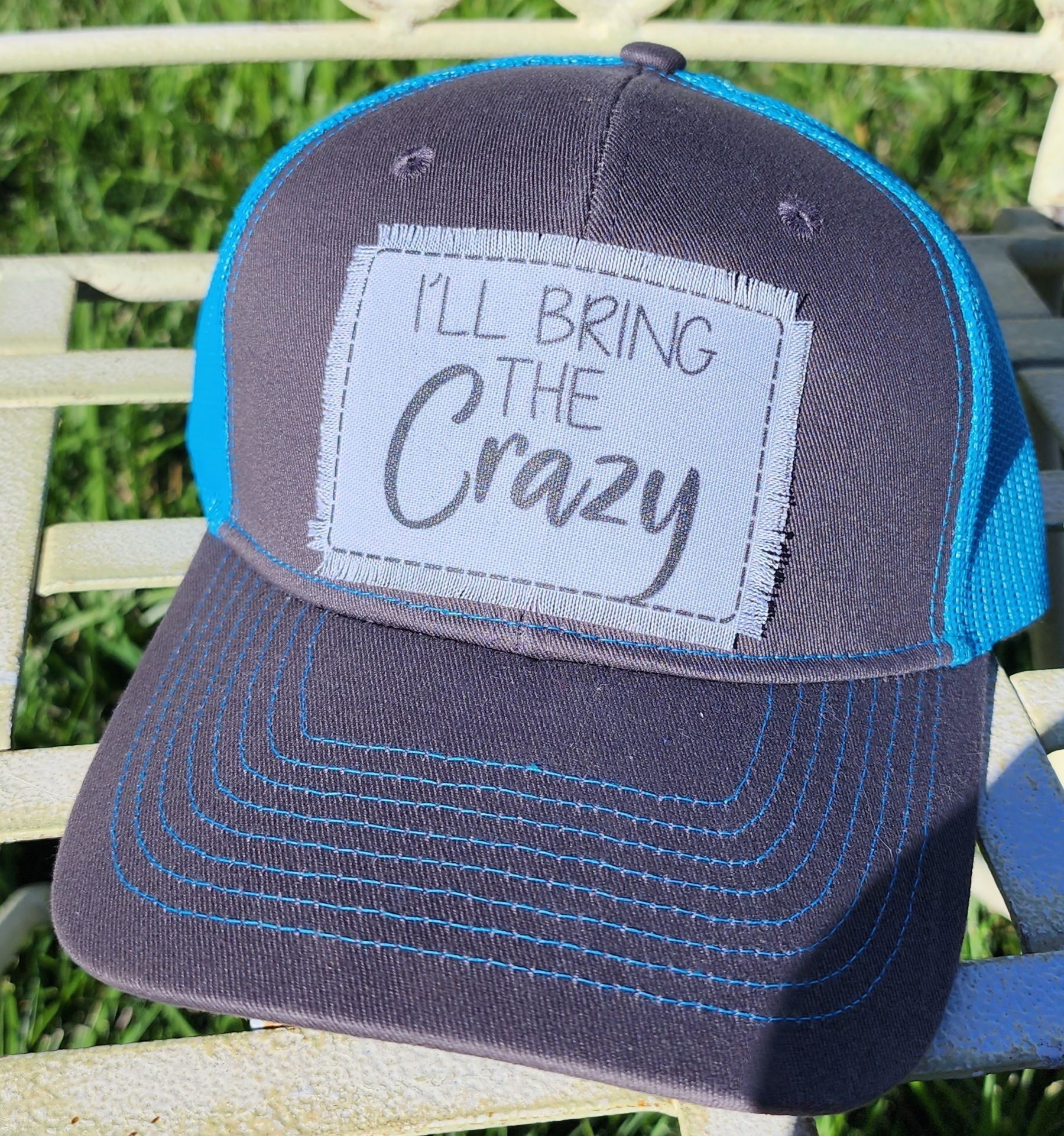 A baseball cap with a patch that says `` i 'll bring the crazy ''