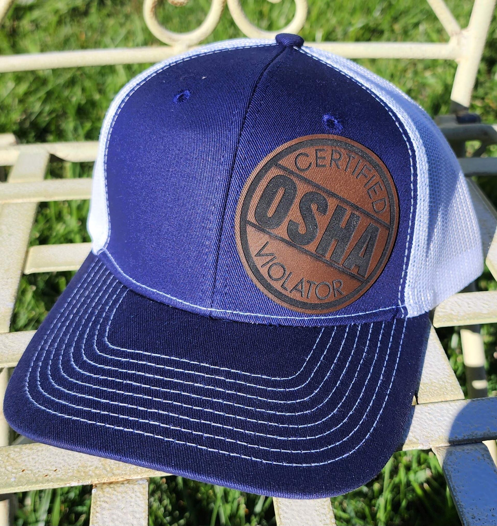 A blue and white hat with the word osha on it