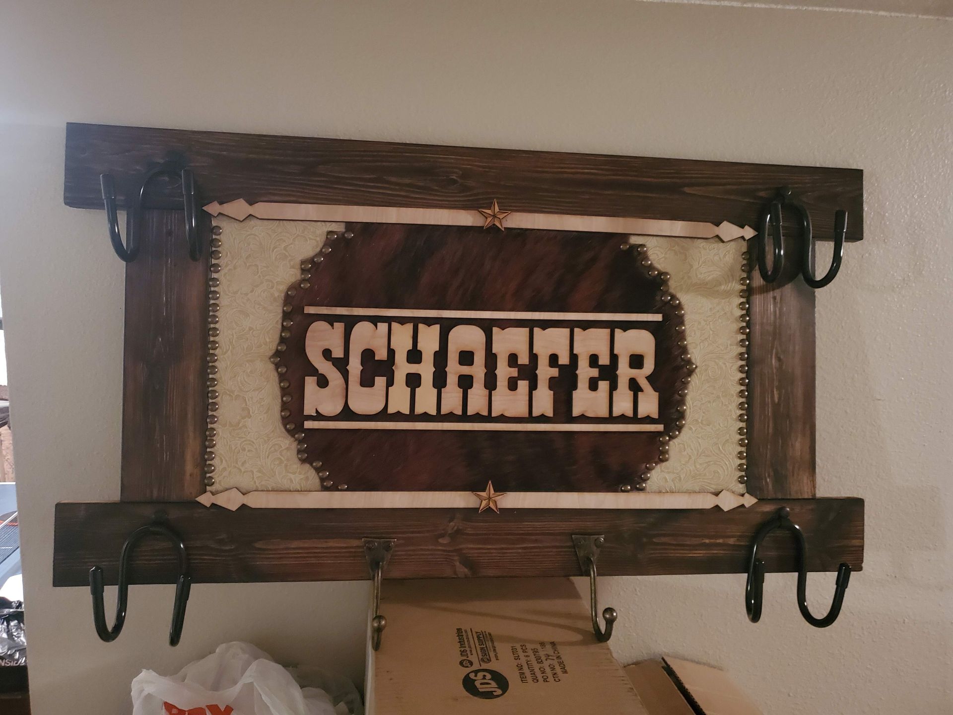 A wooden sign that says schaefer on it