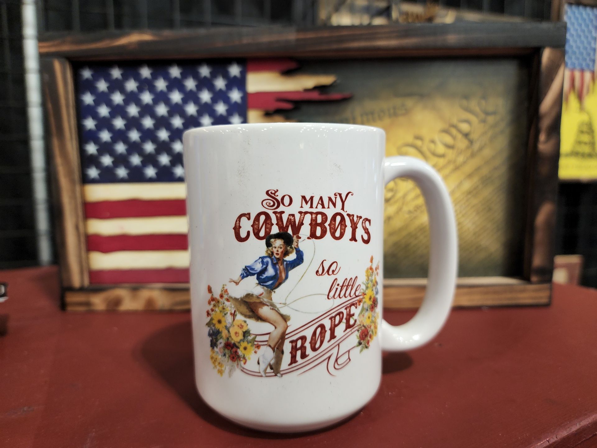 A coffee mug that says so many cowboys
