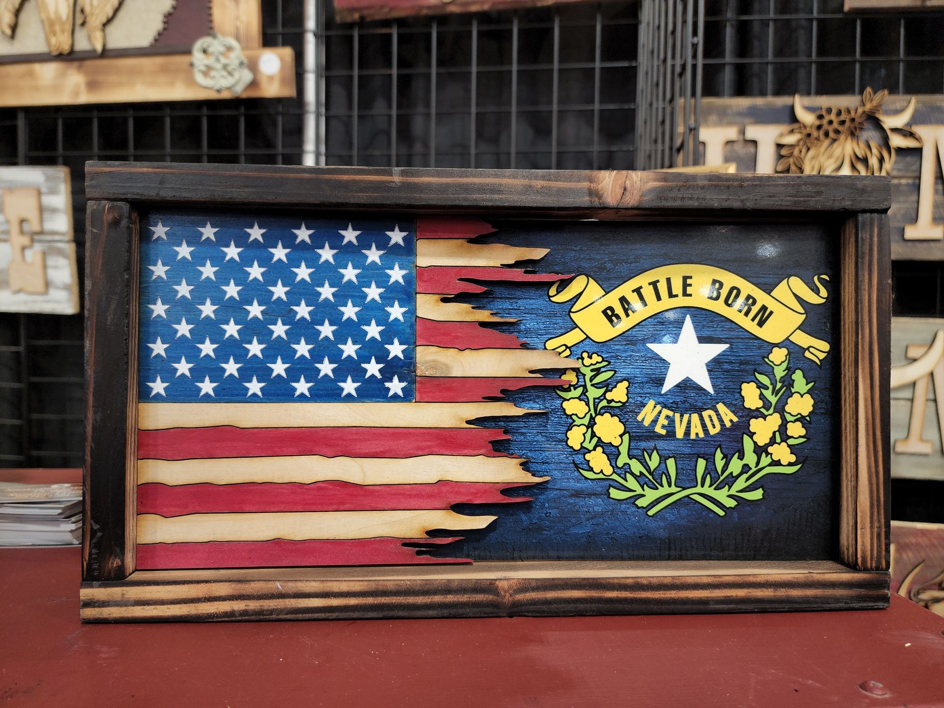 A wooden american flag with the state of nevada on it