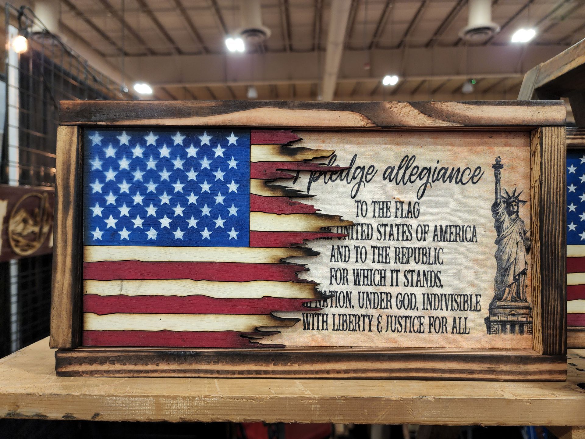 A wooden american flag with the words pledge allegiance to the flag on it