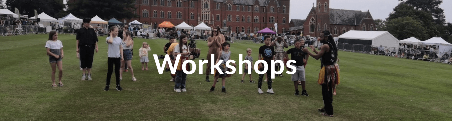 A group of people are standing in a field with the words workshops written on the bottom.
