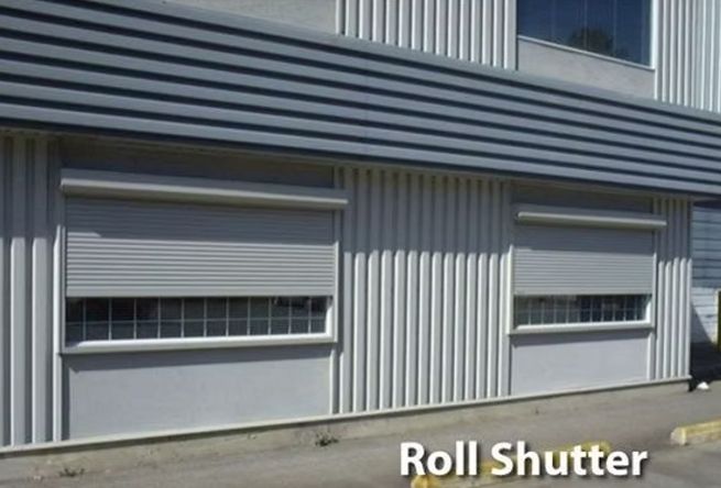 A building with a roll shutter on the side of it