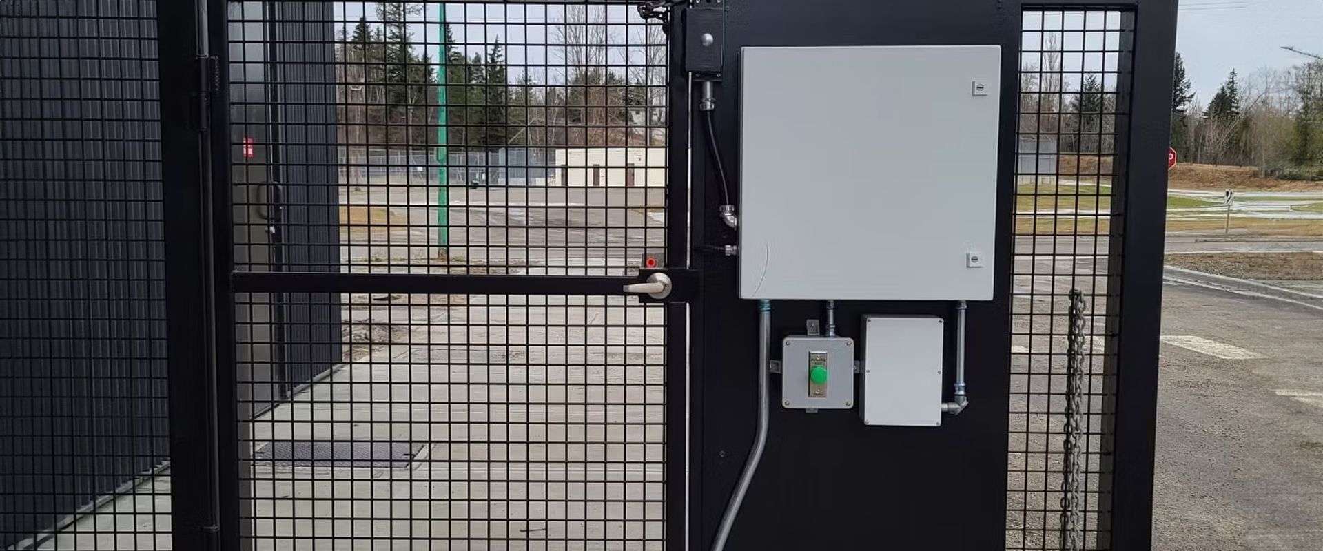 Rows of red lockers in a school hallway with a wooden bench in the foreground.