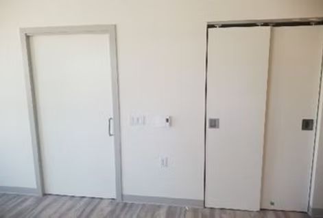 There are two sliding doors in the room.