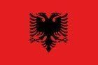 The national flag of Albania, featuring a black double-headed eagle centered on a vibrant red field.
