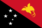The national flag of Papua New Guinea is divided diagonally from the top left to bottom right into black and red fields.