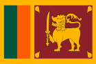 The national flag of Sri Lanka features a golden lion holding a sword on a maroon background, bordered by green and orange.
