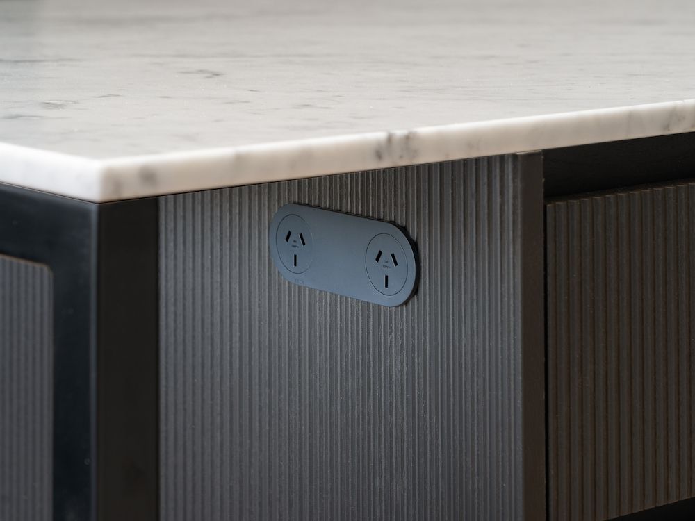 A Kitchen Counter With Two Electrical Outlets on It — Hot Rock Granite In Tweed Heads, NSW