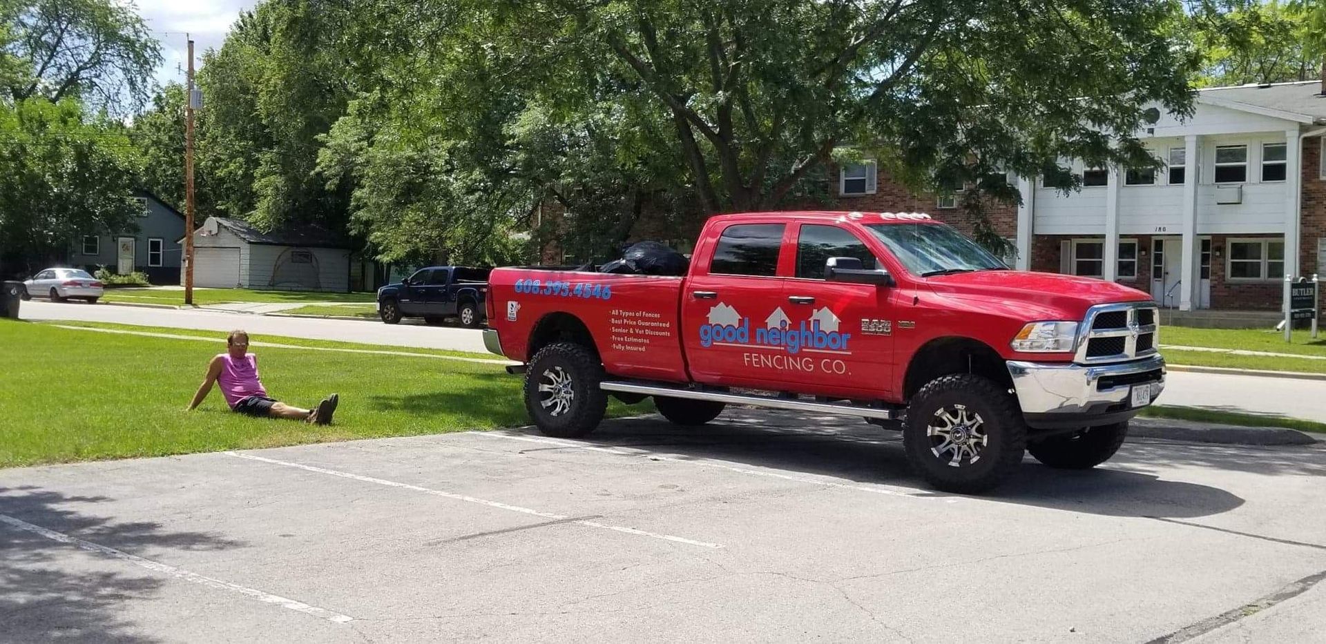 Chad sitting next to logoed truck