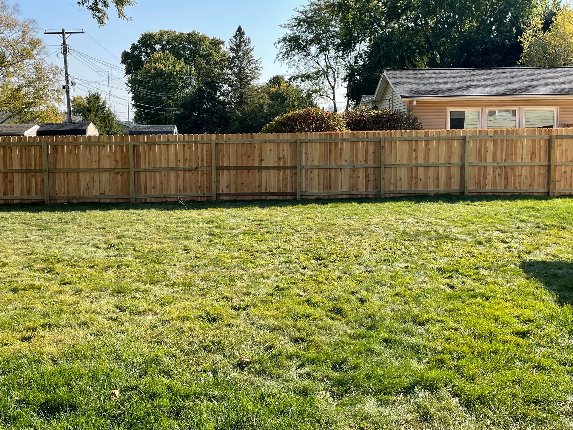 newly installed cedar fence with gate