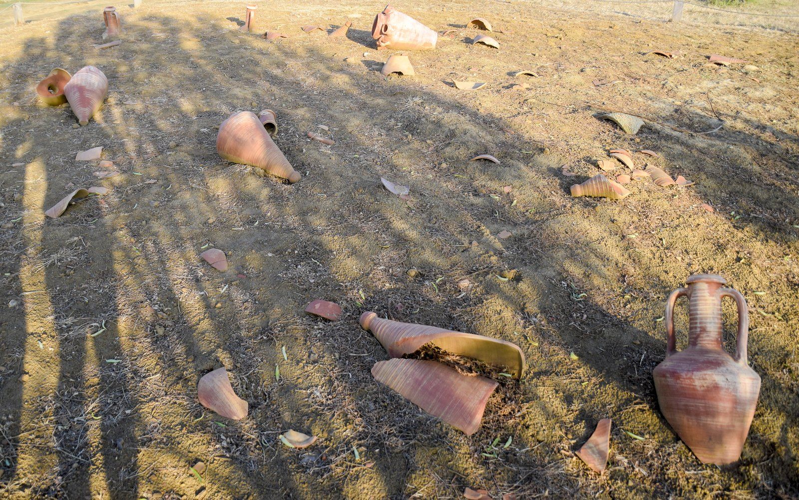 broken vase in the ground