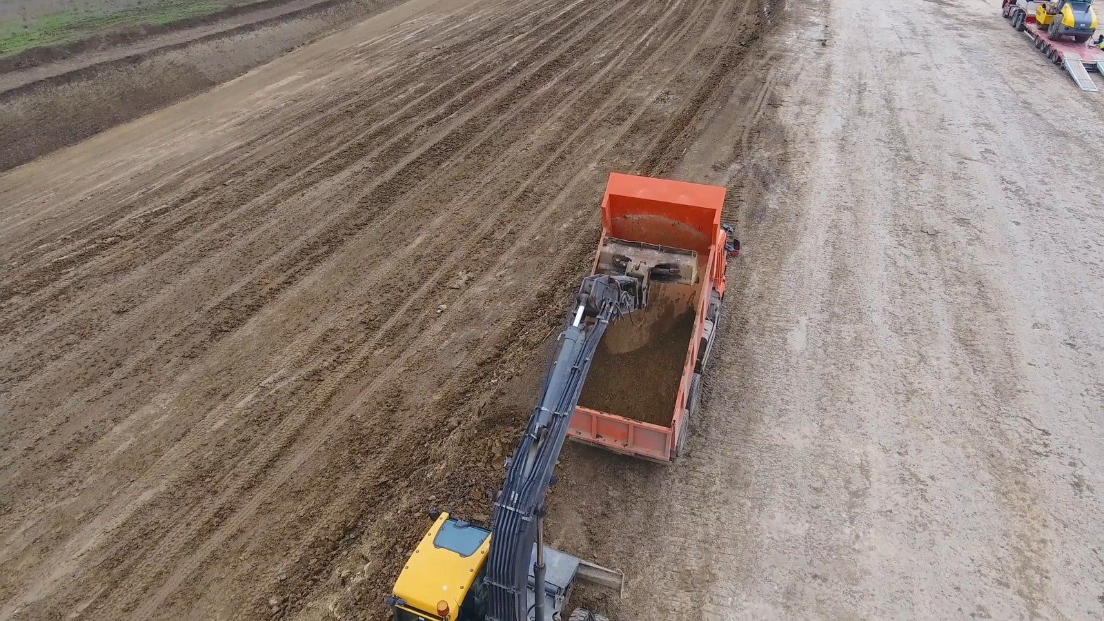 two trucks in the field