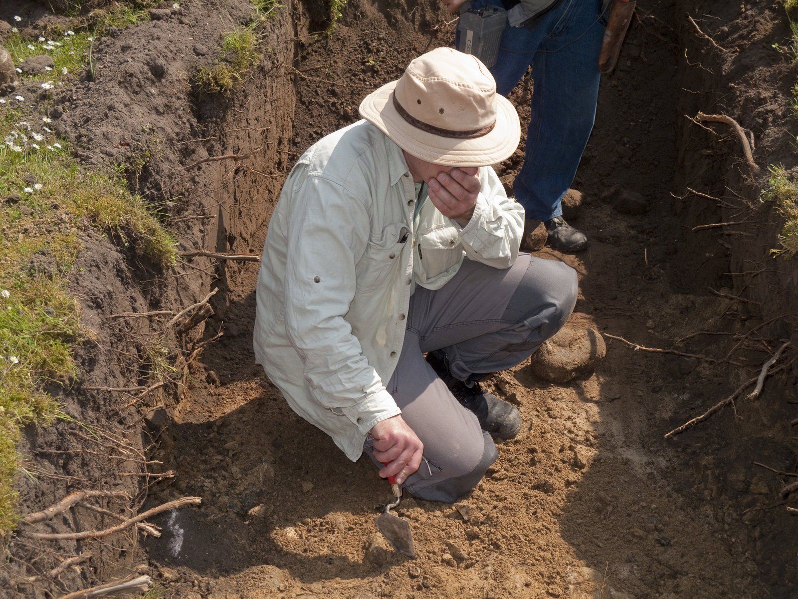man holding a trowel