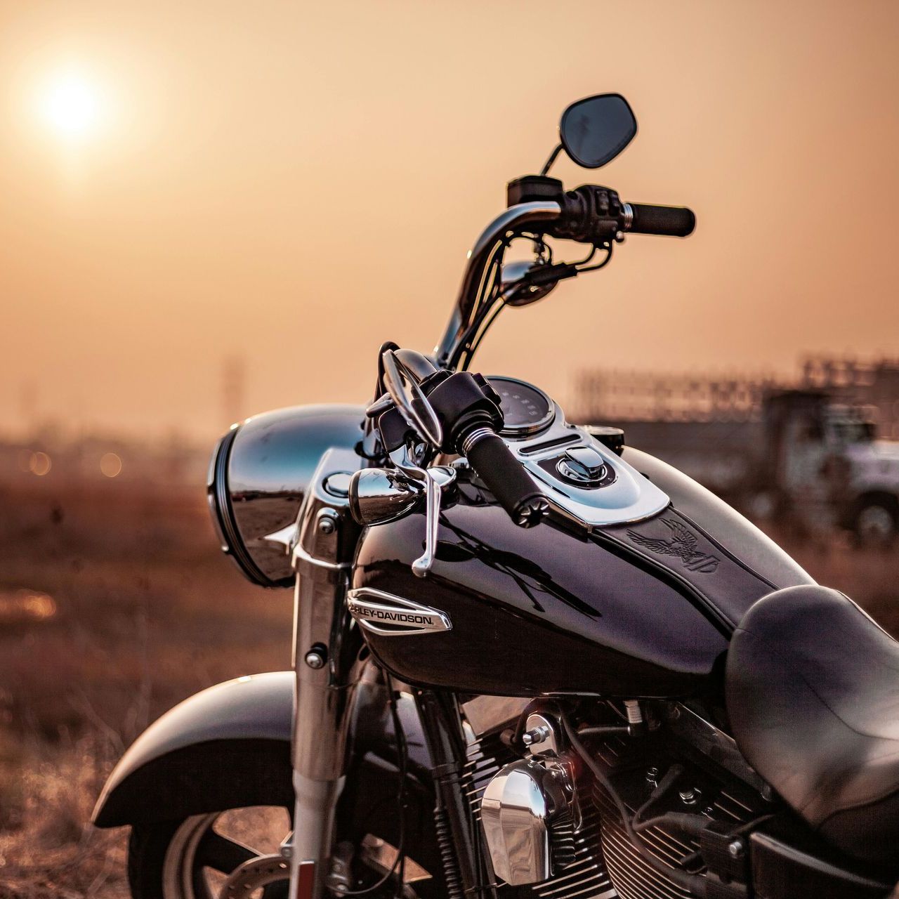 A person driving a car on a highway with a bridge in the background