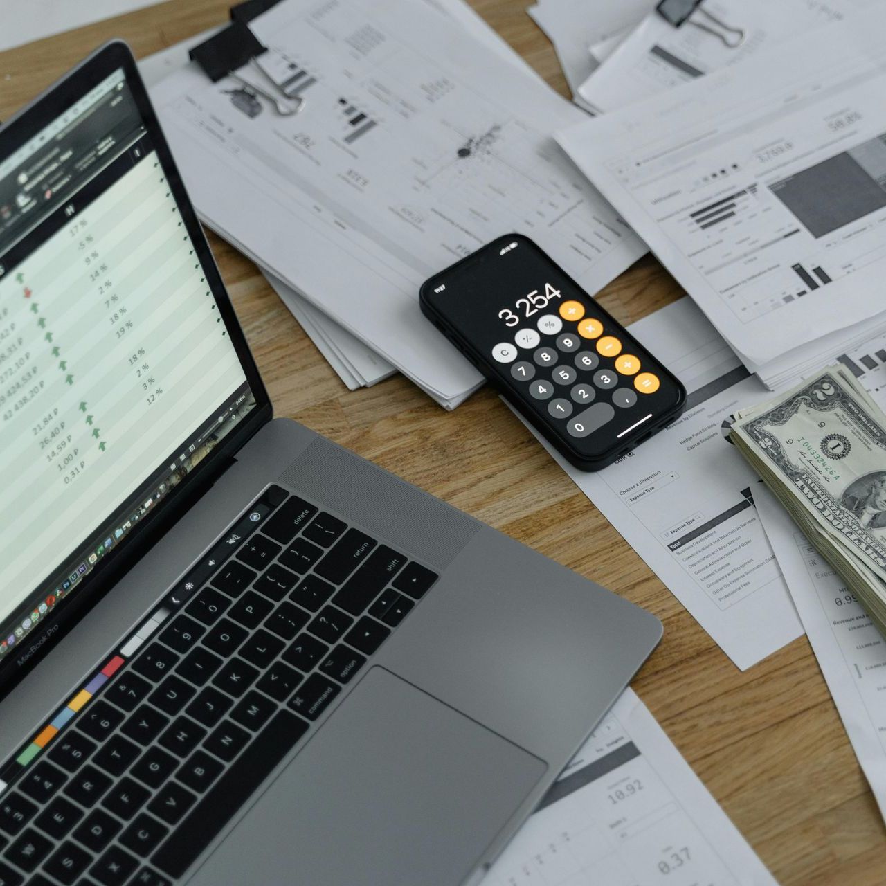 A woman and a child are giving each other a high five while sitting on the roof of a car.