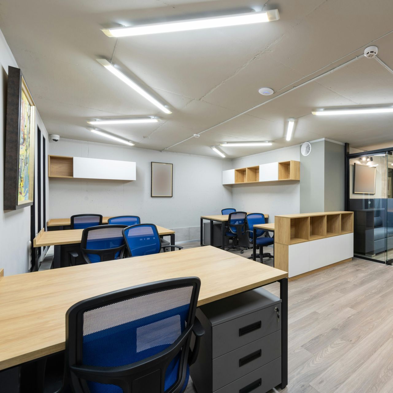 A woman and a child are giving each other a high five while sitting on the roof of a car.