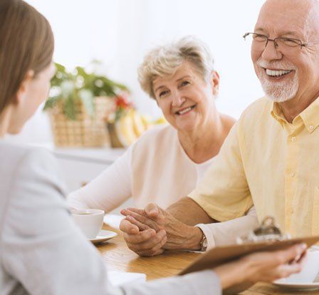 Woman Talking to a Senior Couple — Olympia, WA — Bliss & Skeen, CPAs