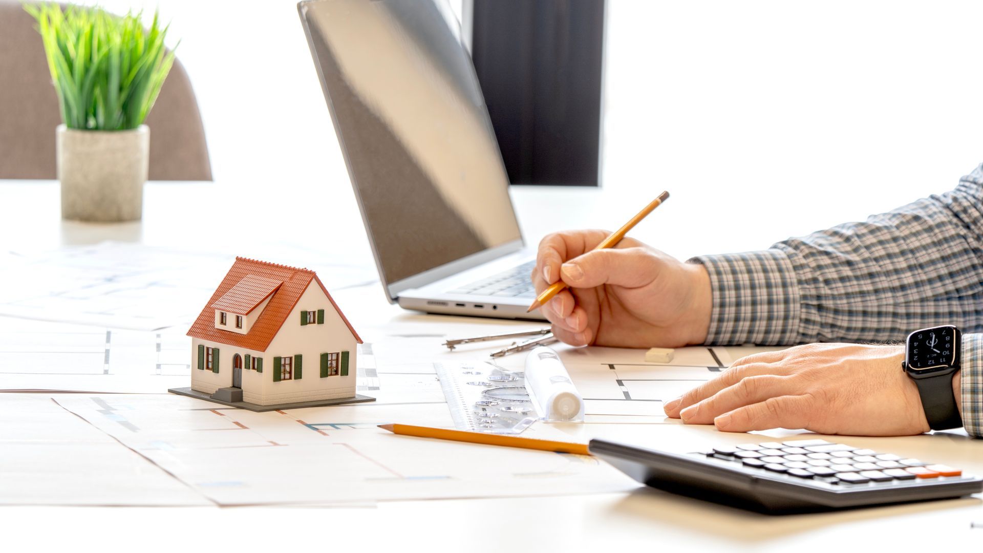 A designer or planner develops a house project. A designer or planner develops a house project.