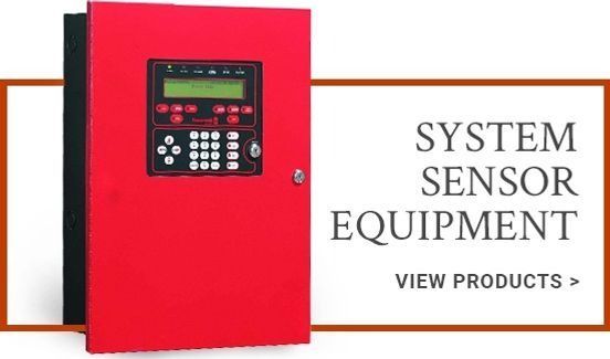 Red wall-mounted system sensor control panel with display and keypad beside text reading “SYSTEM SENSOR EQUIPMENT”