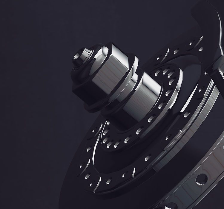 A close up of a metal object on a black background