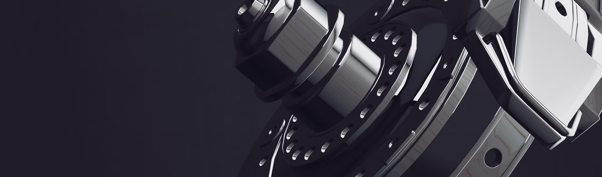 A close up of a metal object on a black background.