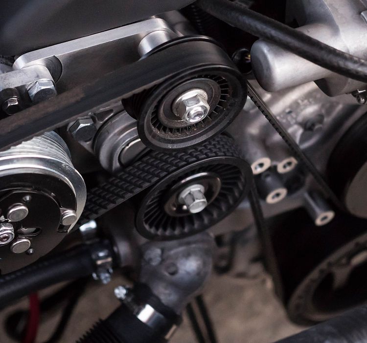 A close up of a belt on a car engine