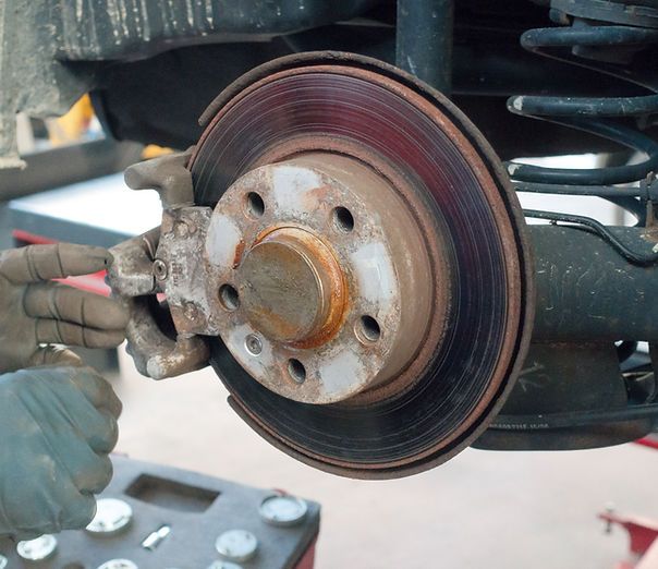 A close up of a brake disc on a car