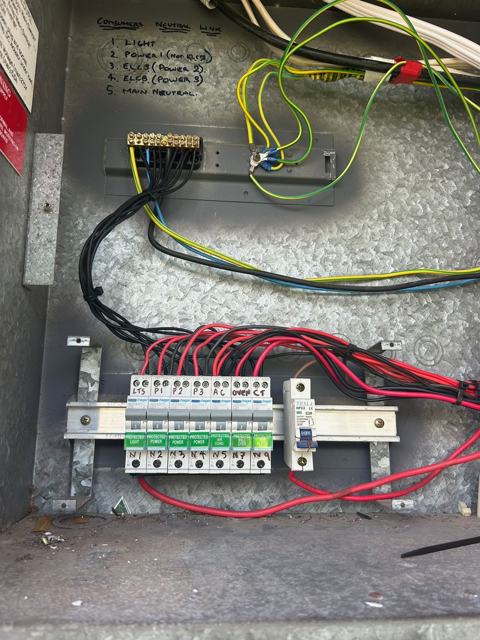 Person With Red Gloves Working On Electrical Panel — Fry Electrical In Bateau Bay, NSW