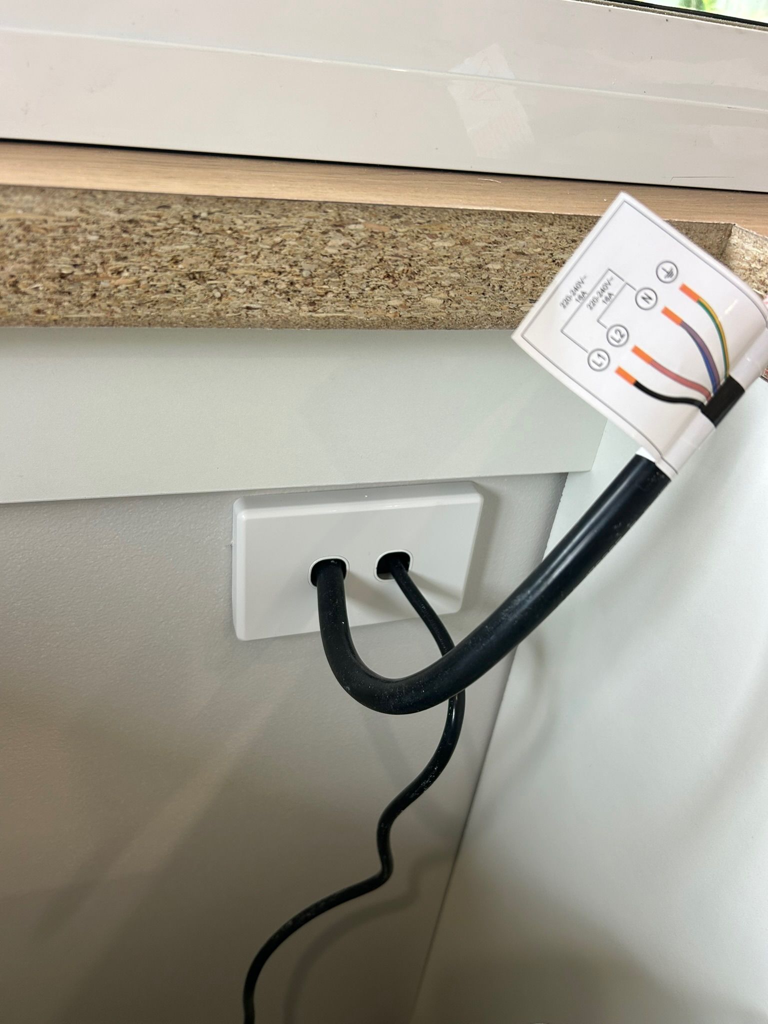 Man With Red Beard, Wearing Gloves And Goggles, Fixing A Ceiling Light In A Hallway — Fry Electrical In Budgewoi, NSW