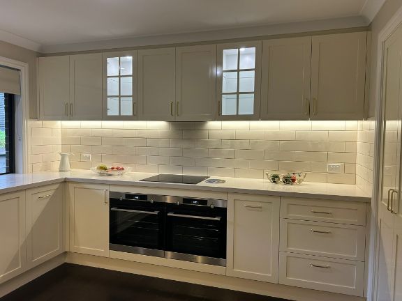 Beige Kitchen With Overhead Cabinets — Fry Electrical In Central Coast, NSW

