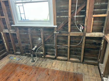 Interior View of a Room With Exposed Wooden Studs — Fry Electrical In Budgewoi, NSW
