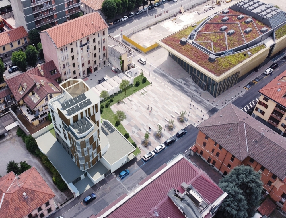 Veduta aerea di una piazza cittadina con gli edifici circostanti e un padiglione con giardino pensile.