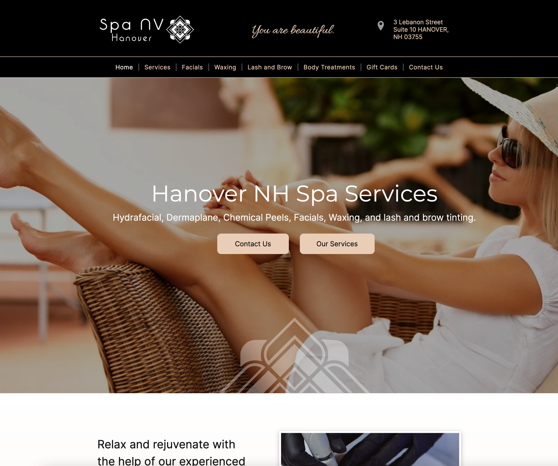 A woman is sitting in a chair with her legs crossed on a website for hanover nh spa services