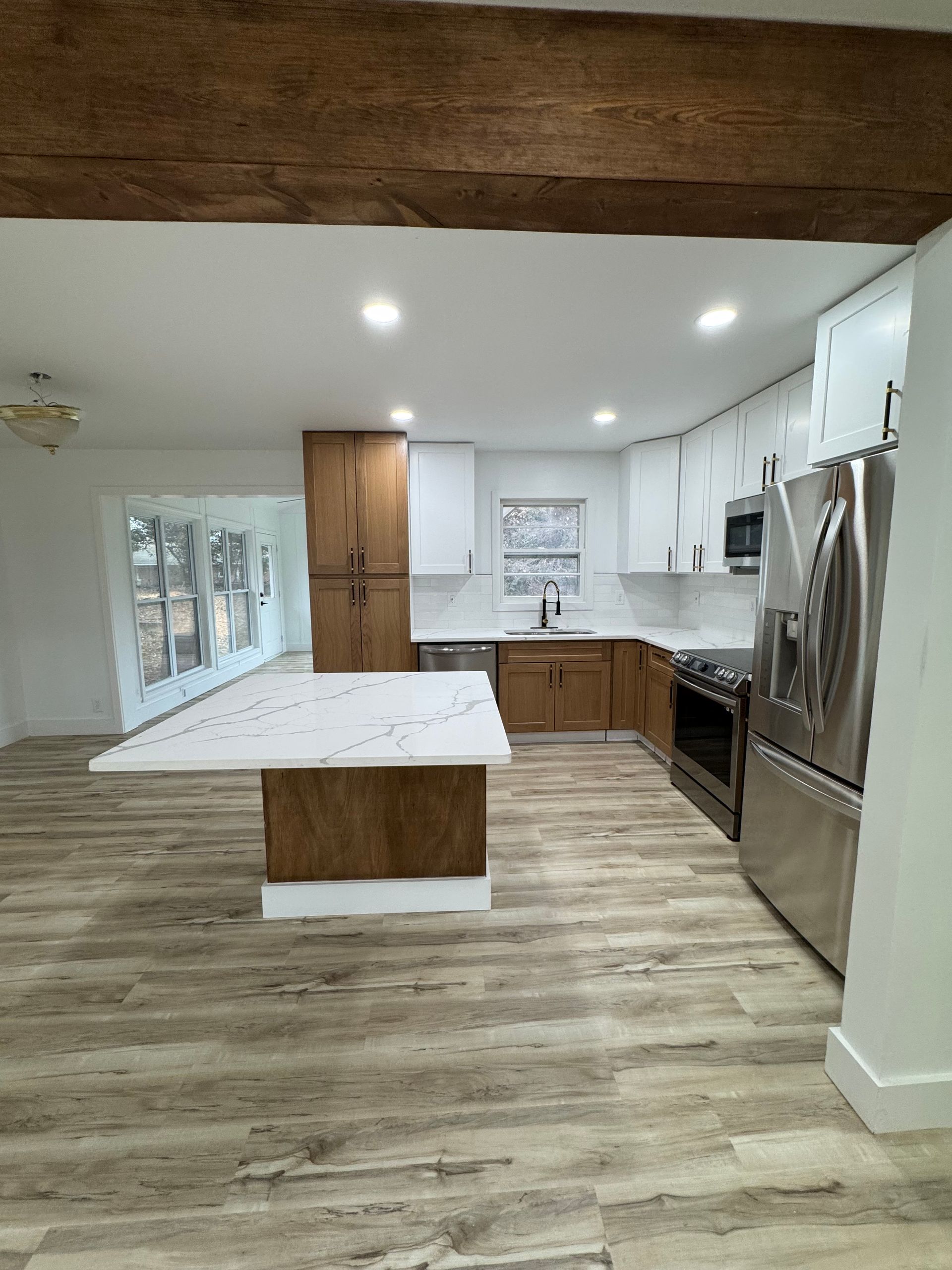 Kitchen remodel with new cabinets, flooring and counter tops