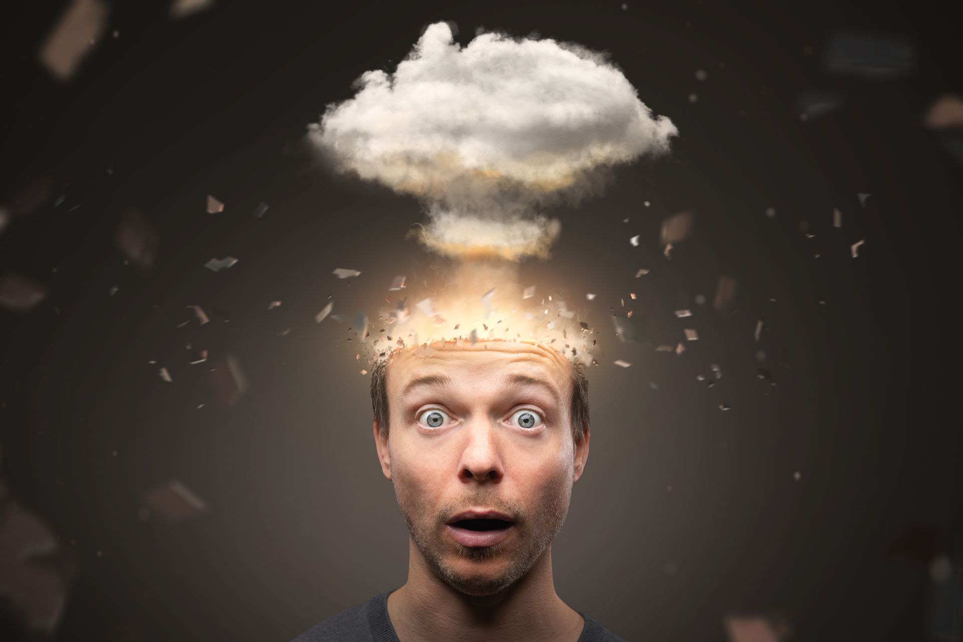 A person with a surprised expression as a cloud resembling a mushroom explosion rises from their head.