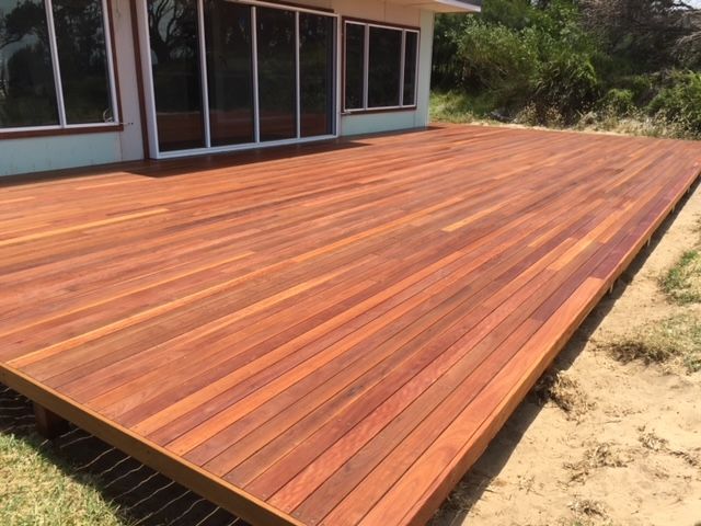 A wooden deck is being built in the backyard of a house. — Brad Griffiths Building In Culburra Beach, NSW