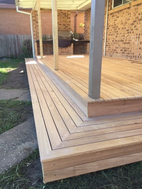 A Green Tile Floor With Brown Stripes On It — Brad Griffiths Building In Culburra Beach, NSW