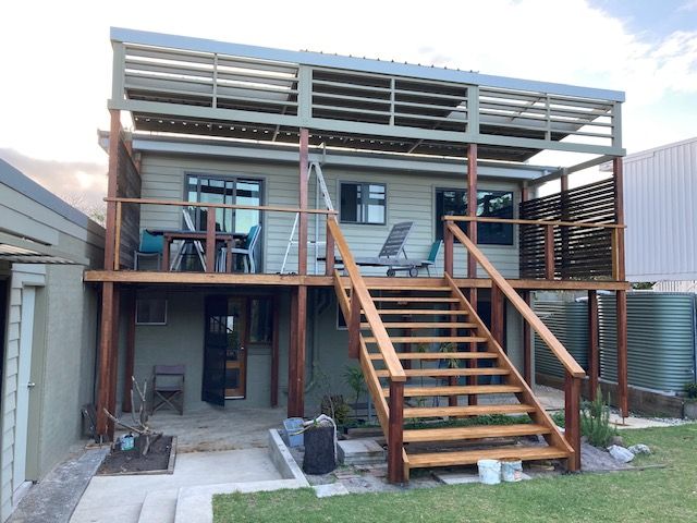 A Bathroom With Two Sinks And A Large Mirror — Brad Griffiths Building In Culburra Beach, NSW