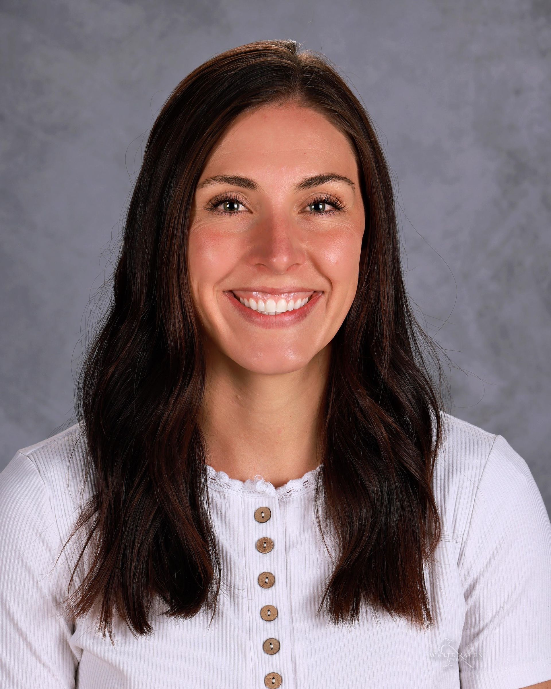 Woman smiling at camera.