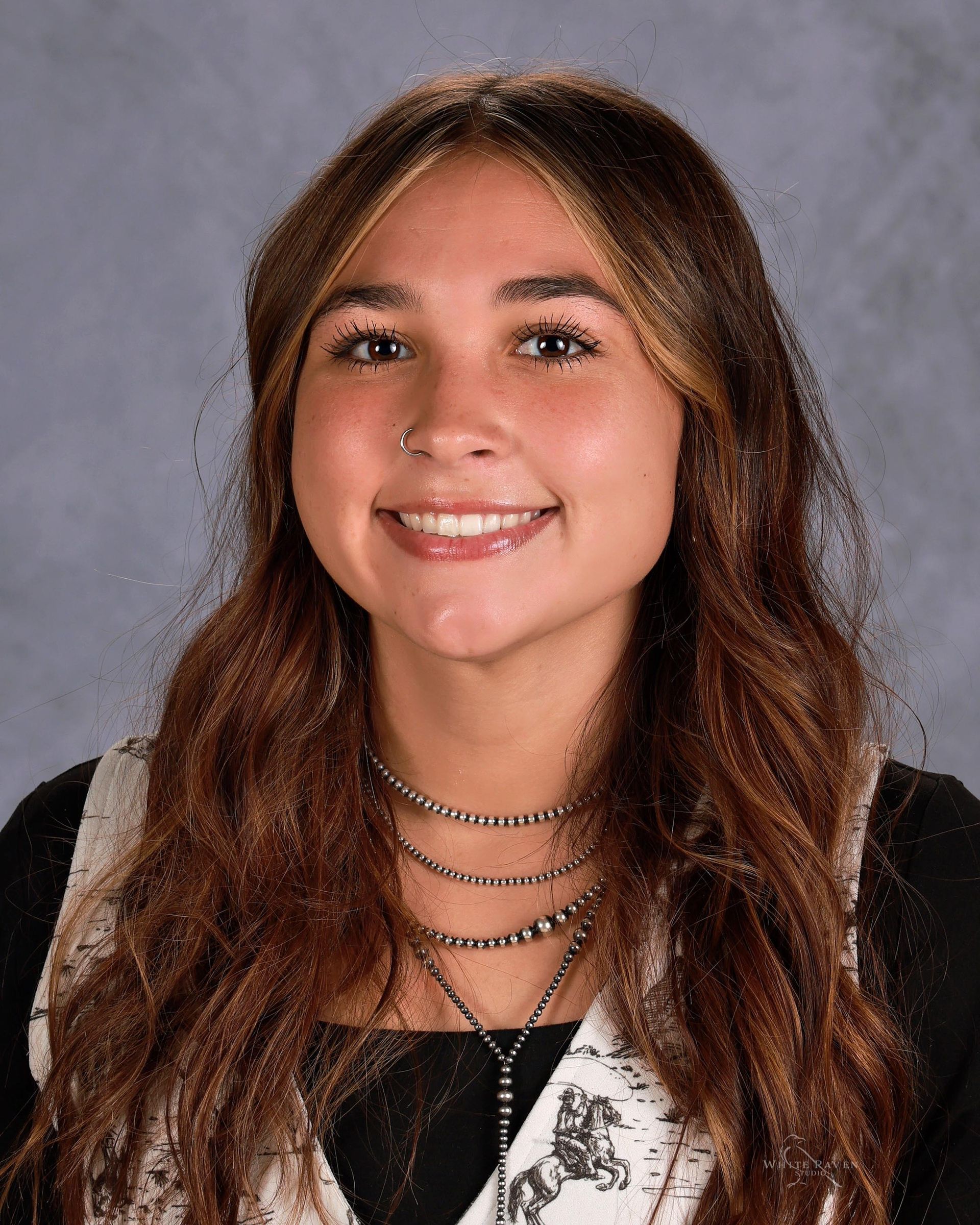 Woman in jacket smiling for camera.