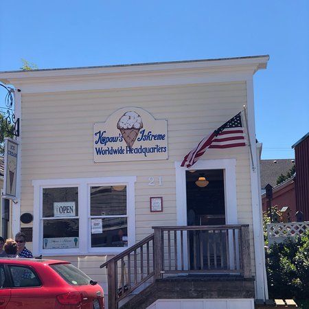 A cream-colored building with a sign reading 