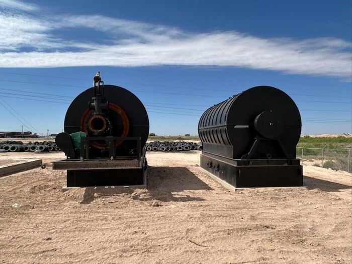 A 3d model of a factory with a blue engine.