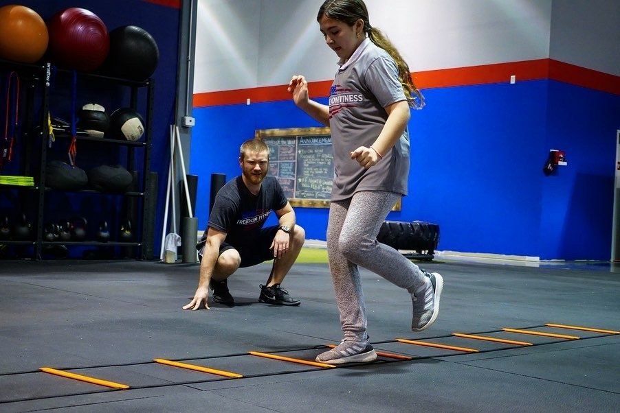 Young girl doing training in a gym